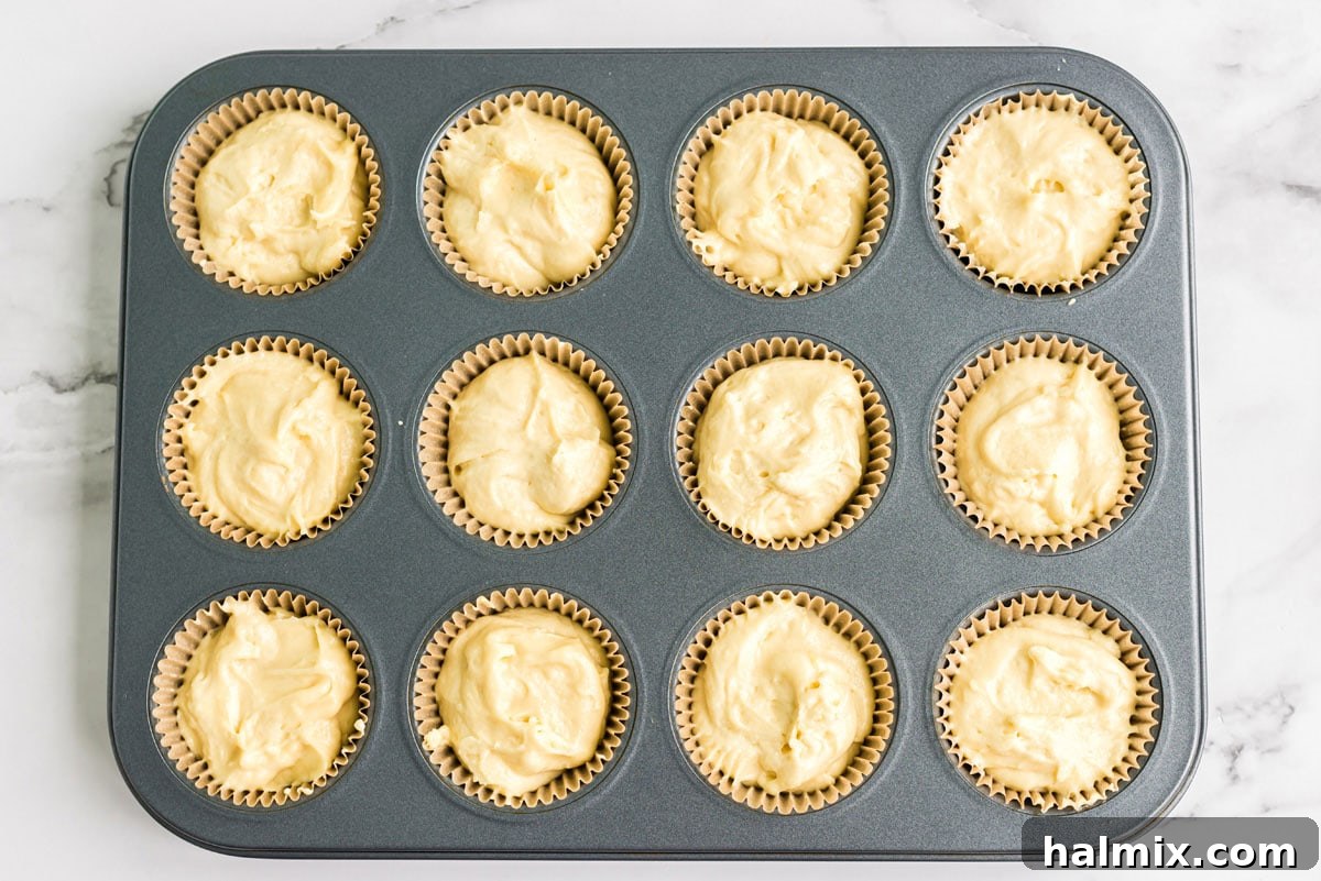 muffin pan filled with cupcake batter