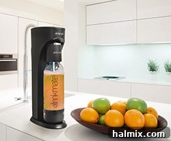 Gifts for the Gourmet Foodie 11 A refreshing scene with a Drinkmate Beverage Carbonation Maker next to a bowl of oranges, highlighting its versatility.