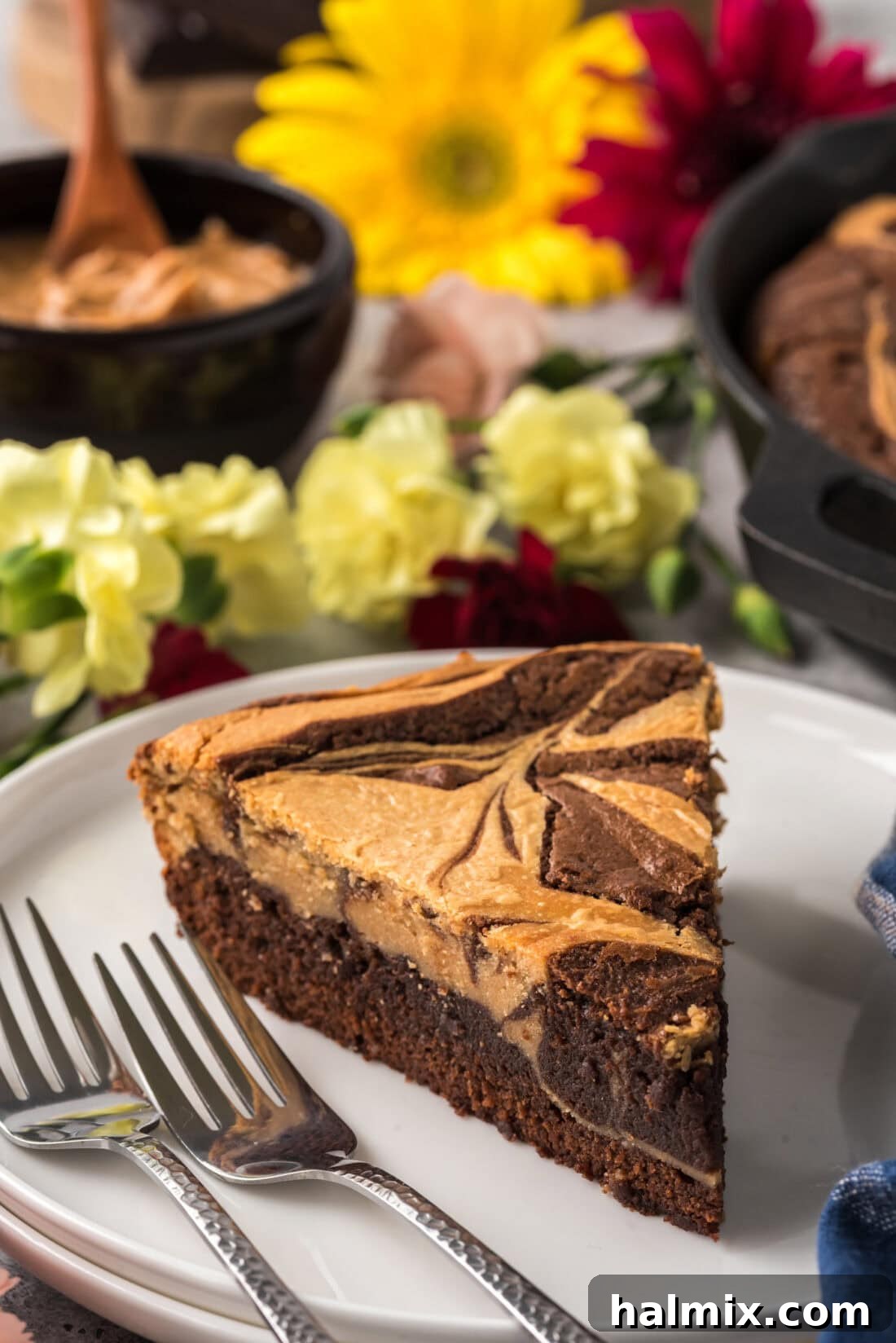 A perfect slice of Peanut Butter Marbled Brownie Skillet Pie served on a white plate