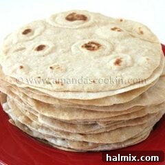 A close up photo of a stack of low fat homemade flour tortillas.