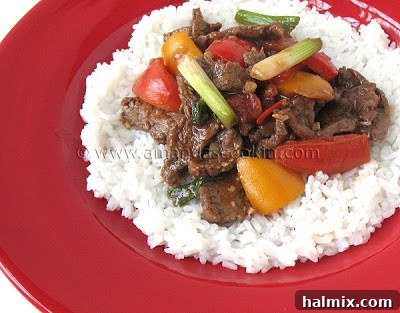 Sizzling Beef Stir-Fry with Sweet Peppers and Tomatoes 2 Delicious Beef Stir Fry with Tomatoes and Peppers served over rice