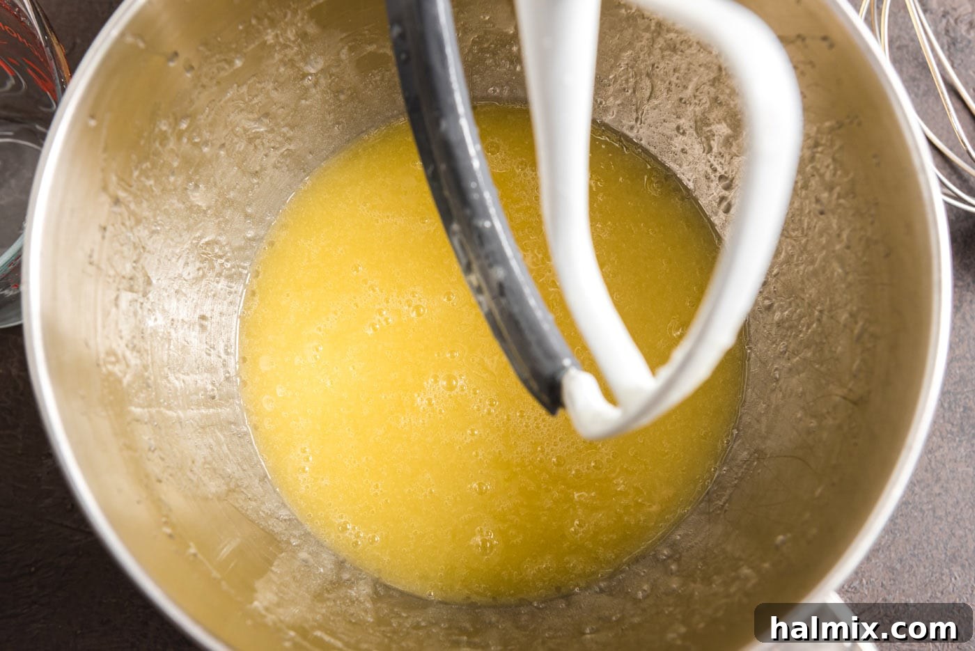 combining melted butter and canola oil in a bowl