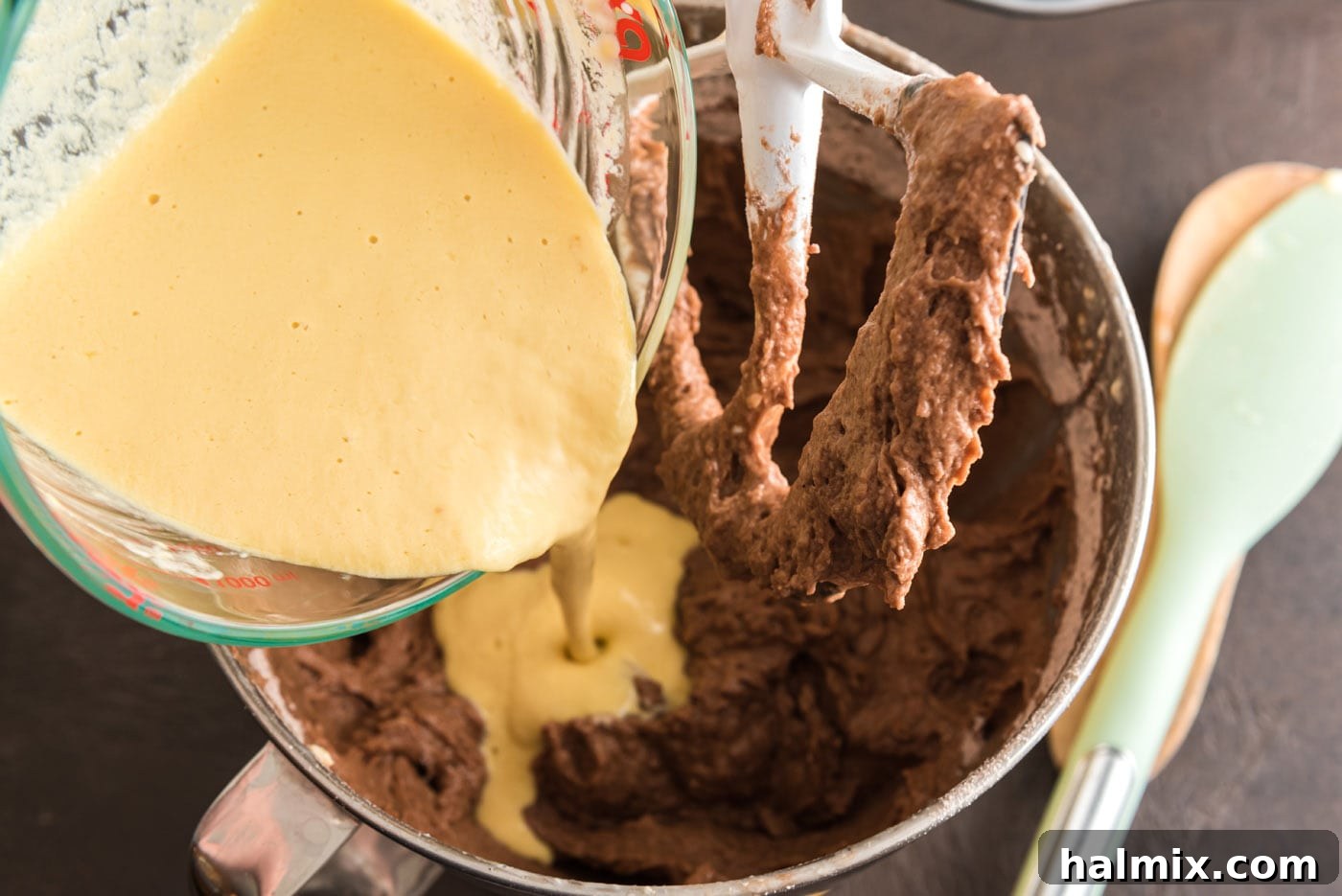 pouring wet ingredients into chocolate mixture