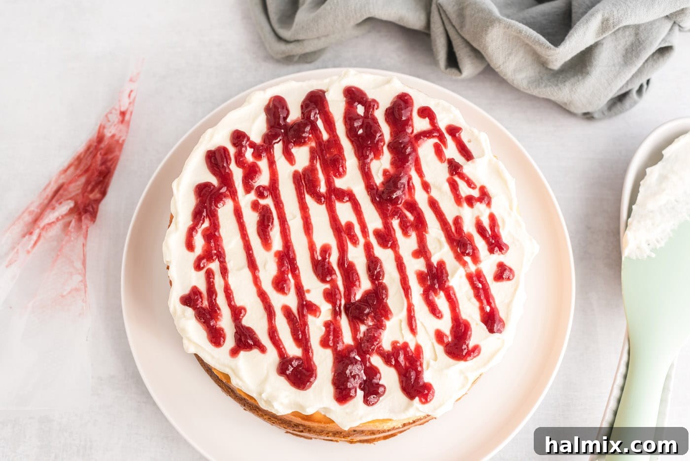 Regal Trifle Cheesecake 14 Raspberry preserve drizzle artfully applied on top of the English trifle cheesecake