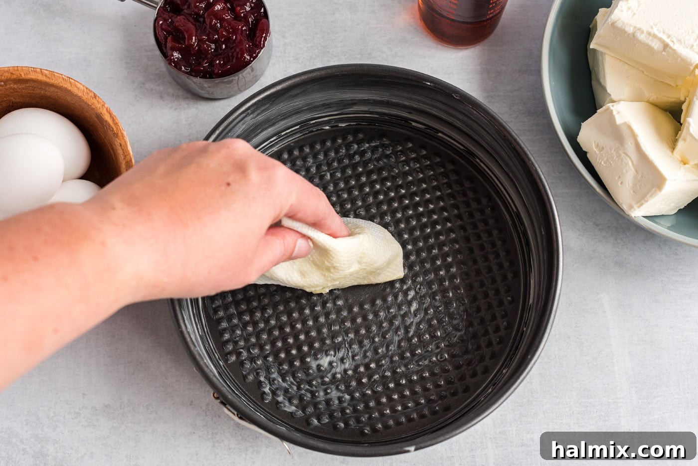 Regal Trifle Cheesecake 5 Buttering a springform pan for cheesecake preparation