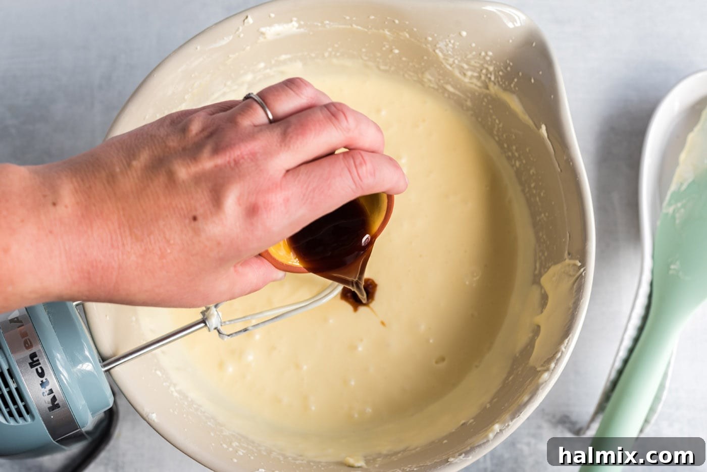 Regal Trifle Cheesecake 8 Adding vanilla extract to the creamy cheesecake mixture