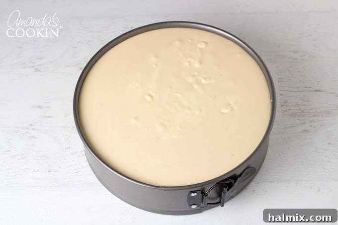 How to make Tiramisu Cheesecake: Pouring remaining batter to fill the pan