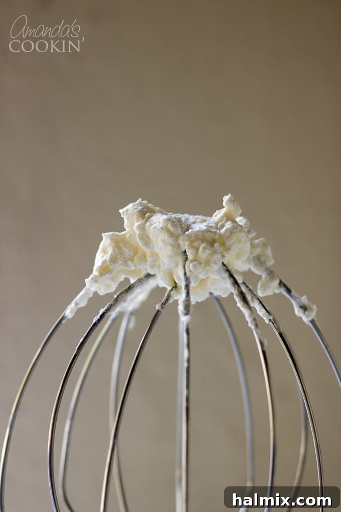 How to make Tiramisu Cheesecake: Beating heavy whipping cream for topping