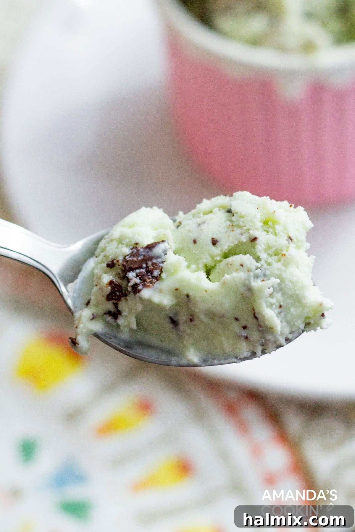 Crafted Mint Chocolate Chip Indulgence 4 A spoonful of rich, homemade mint chocolate chip ice cream, showcasing its perfect scoopability and the distribution of chocolate shards.