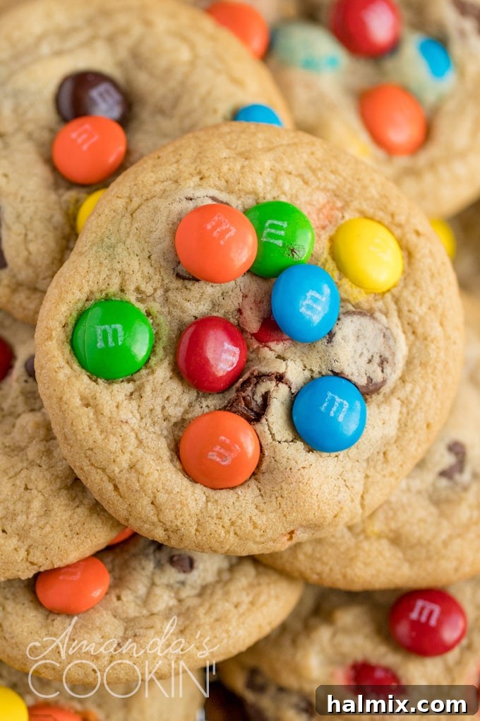 A close-up shot of a perfect chocolate chip M&M cookie. A delicious close-up of a freshly baked chocolate chip M&M cookie, showing its texture and vibrant candies.