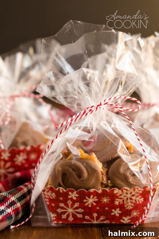 Several homemade chocolate turtles individually wrapped in clear cellophane bags, tied with festive ribbons, ready for gifting.
