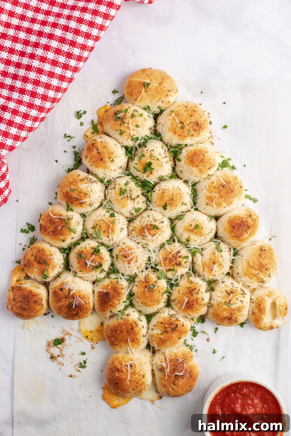 Festive Christmas Tree Pull-Apart Bread 2 Christmas Tree Pull Apart Bread topped with fresh parsley and parmesan