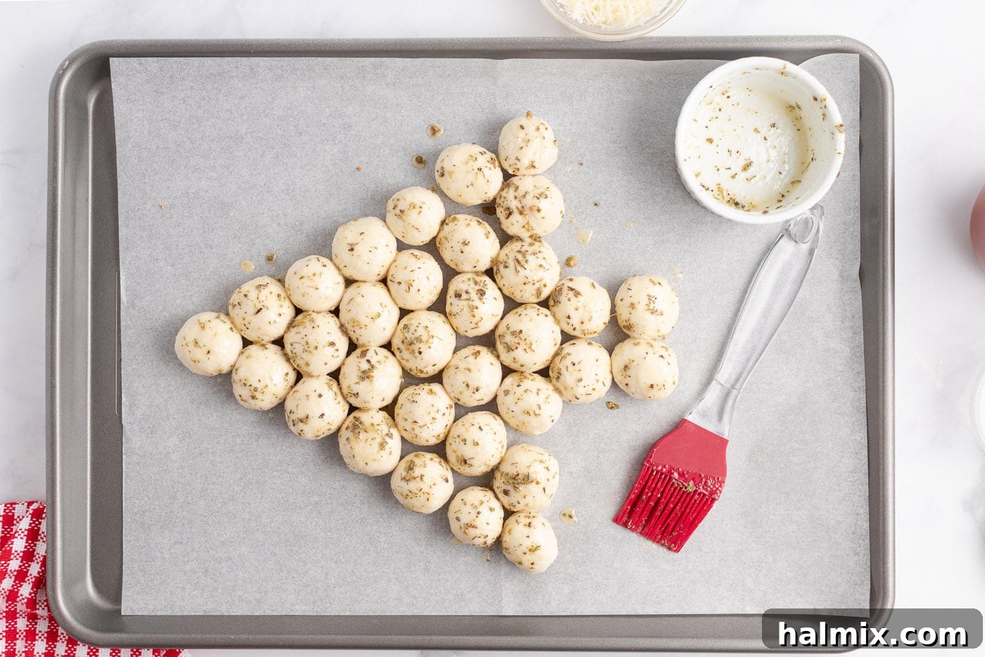 Festive Christmas Tree Pull-Apart Bread 8 Butter mixture brushed on top of the dough balls