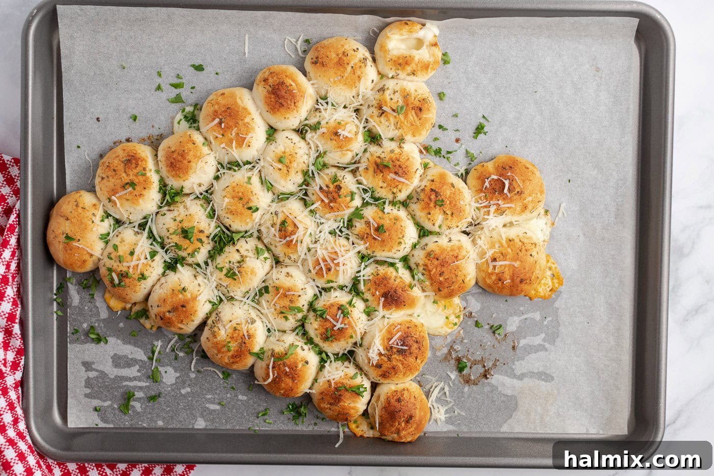 Festive Christmas Tree Pull-Apart Bread 10 Christmas Tree Pull Apart Bread topped with fresh parsley and parmesan cheese