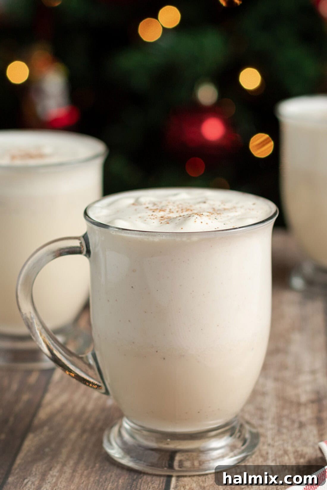Close up photo of creamy Homemade Eggnog in a mug, garnished with nutmeg