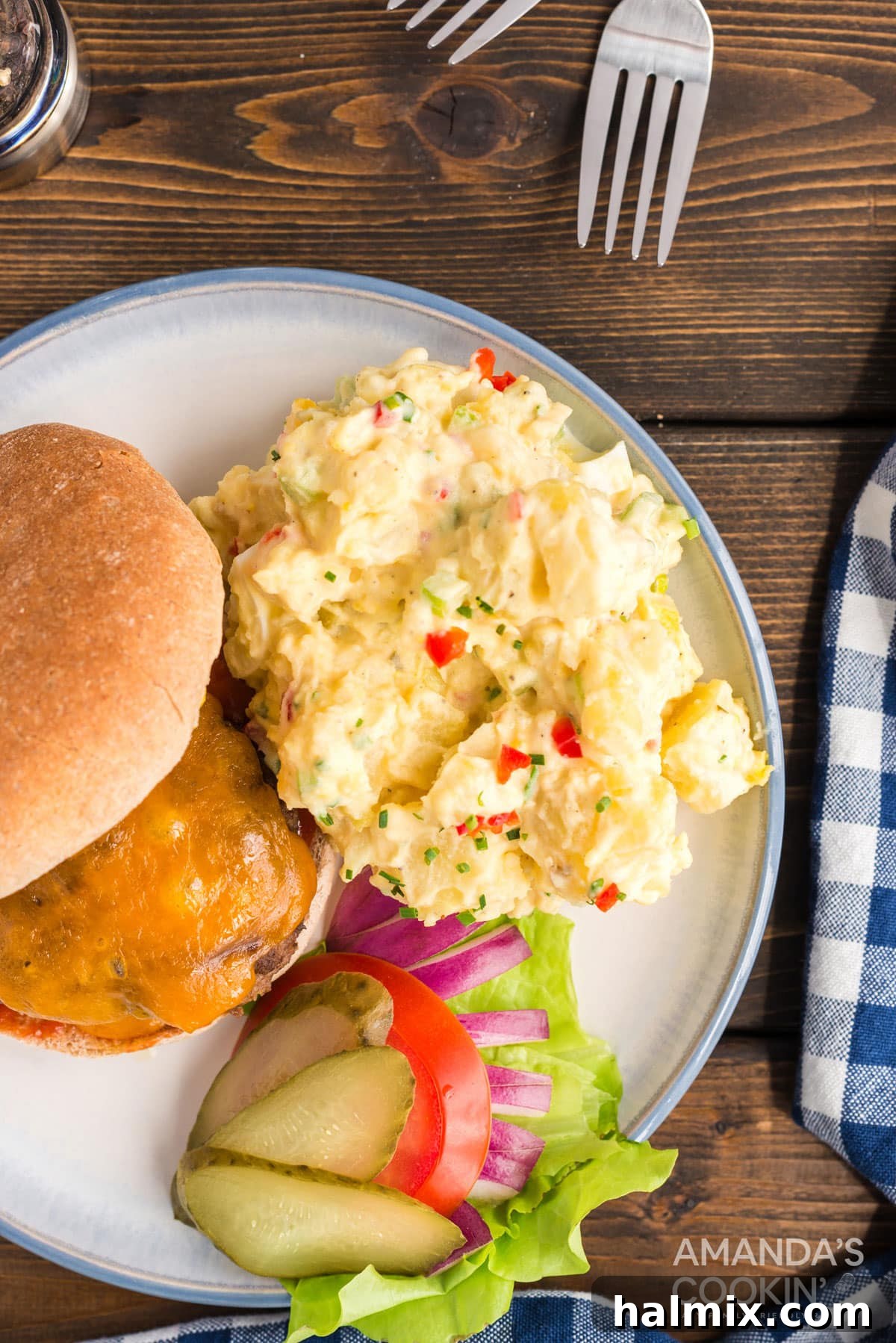 If you're looking for that perfect potato salad, you have to try my mom's recipe. I love my mom's potato salad, it's a classic and the hit of the party! potato salad on the side with a burger and toppings