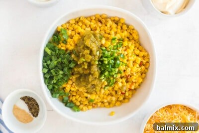 bowl of corn with green chiles, jalapeno, and green onion added