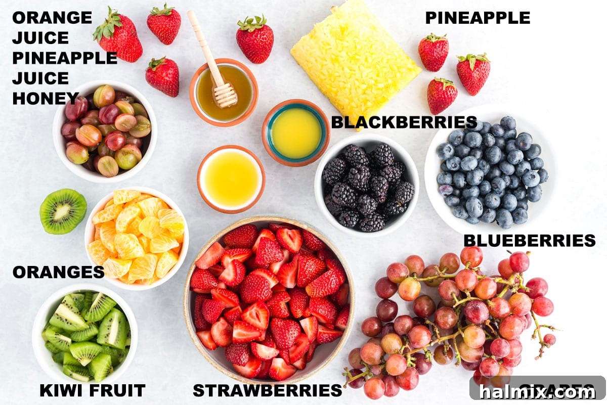 Rainbow Fruit Delight 2 Labeled ingredients for fruit salad, neatly arranged on a counter, ready for preparation