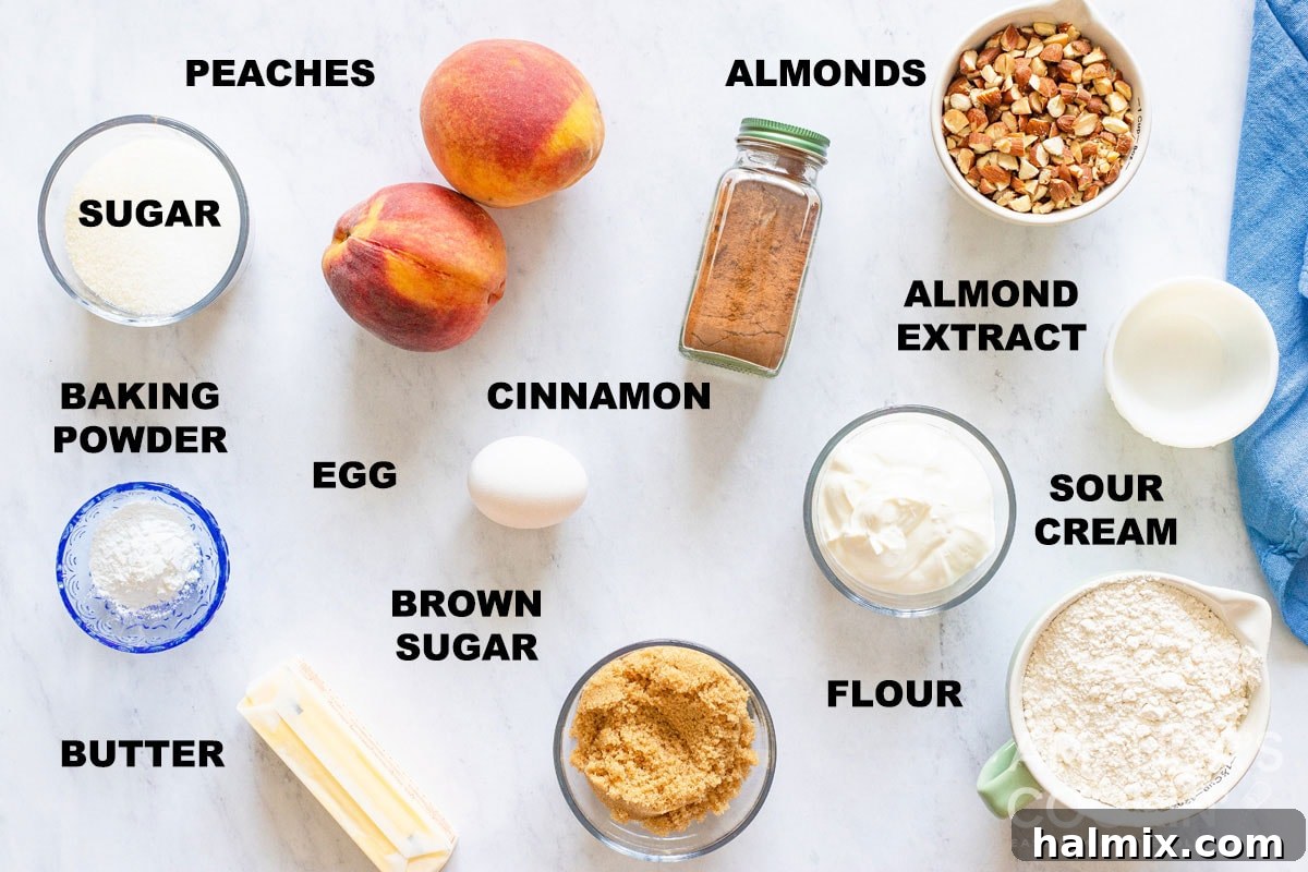 A collection of labeled ingredients for making peach bread, including butter, sugars, peaches, and almonds, neatly arranged on a counter.