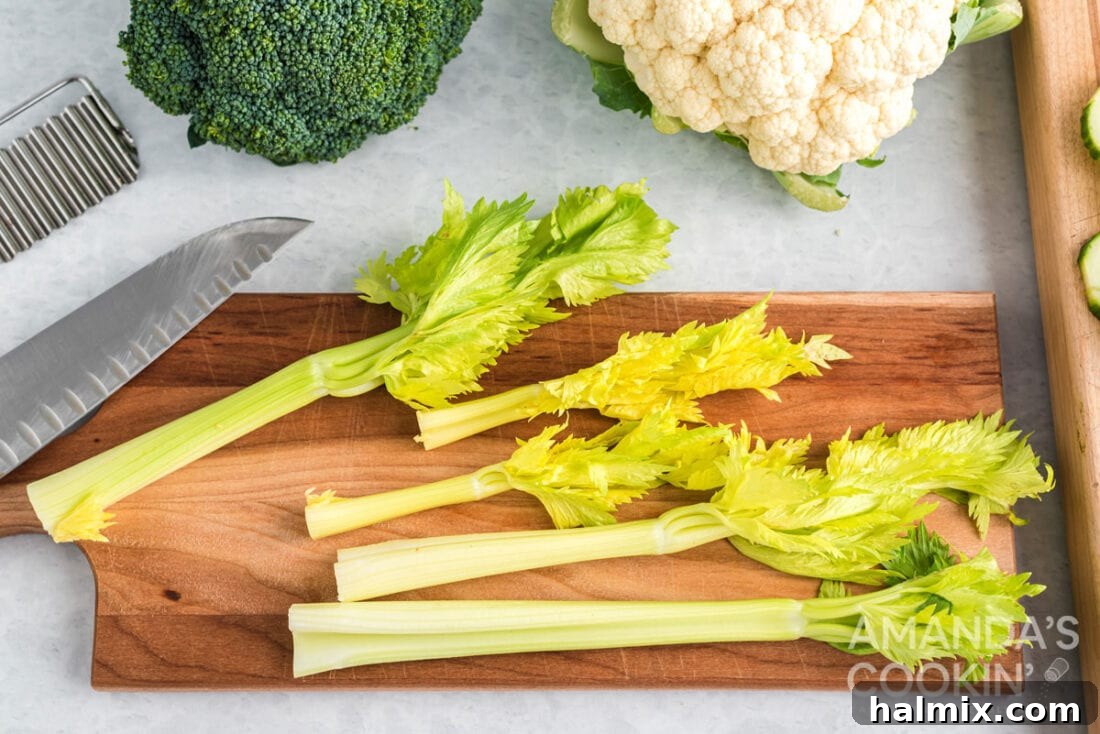 Edible Sculptures: Crafting Decorative Vegetables 11 Fresh celery stalks with their leafy tops intact, ready for a rustic and appealing display.