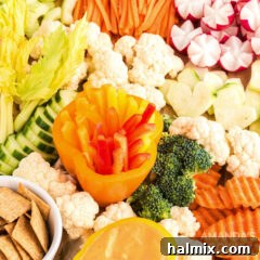 Edible Sculptures: Crafting Decorative Vegetables 14 A close-up of various raw vegetables arranged on a white background, highlighting their fresh appearance.