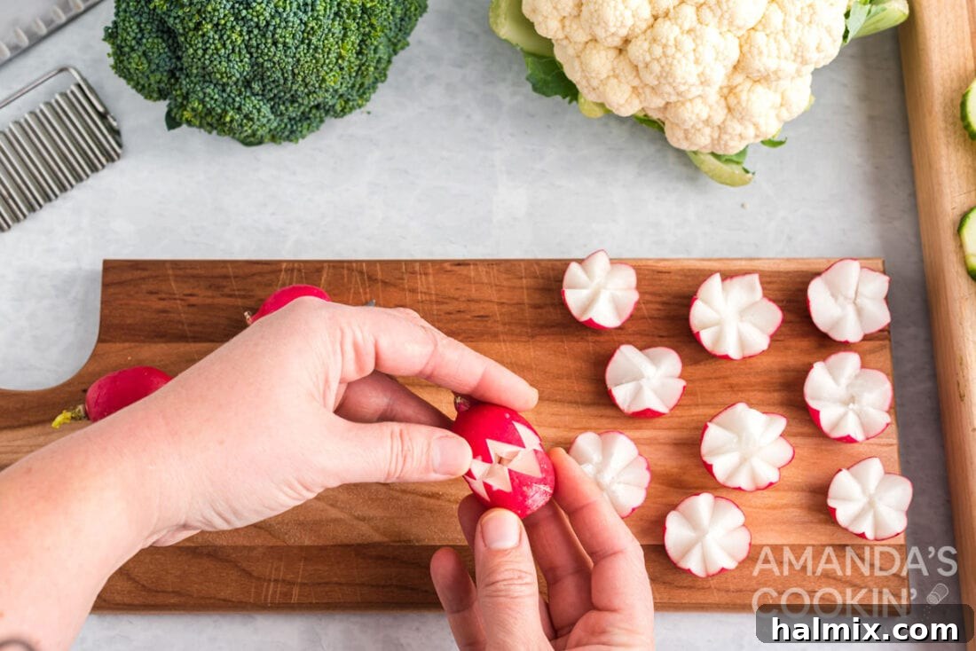 Edible Sculptures: Crafting Decorative Vegetables 10 A carved radish partially opened, showing the intricate petal design before full bloom in iced water.
