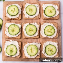wood board of cucumber sandwiches