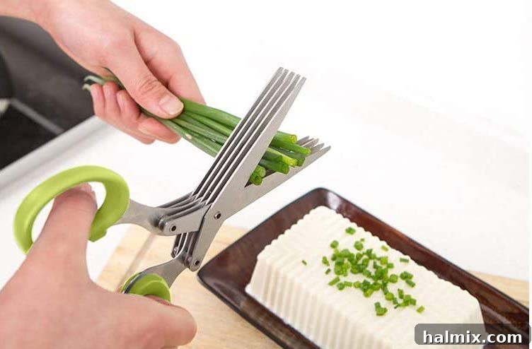 21 Clever Kitchen Gadgets You'll Use Constantly 11 Cutting fresh chives with multi-blade herb scissors, demonstrating their ease of use for quick herb preparation.
