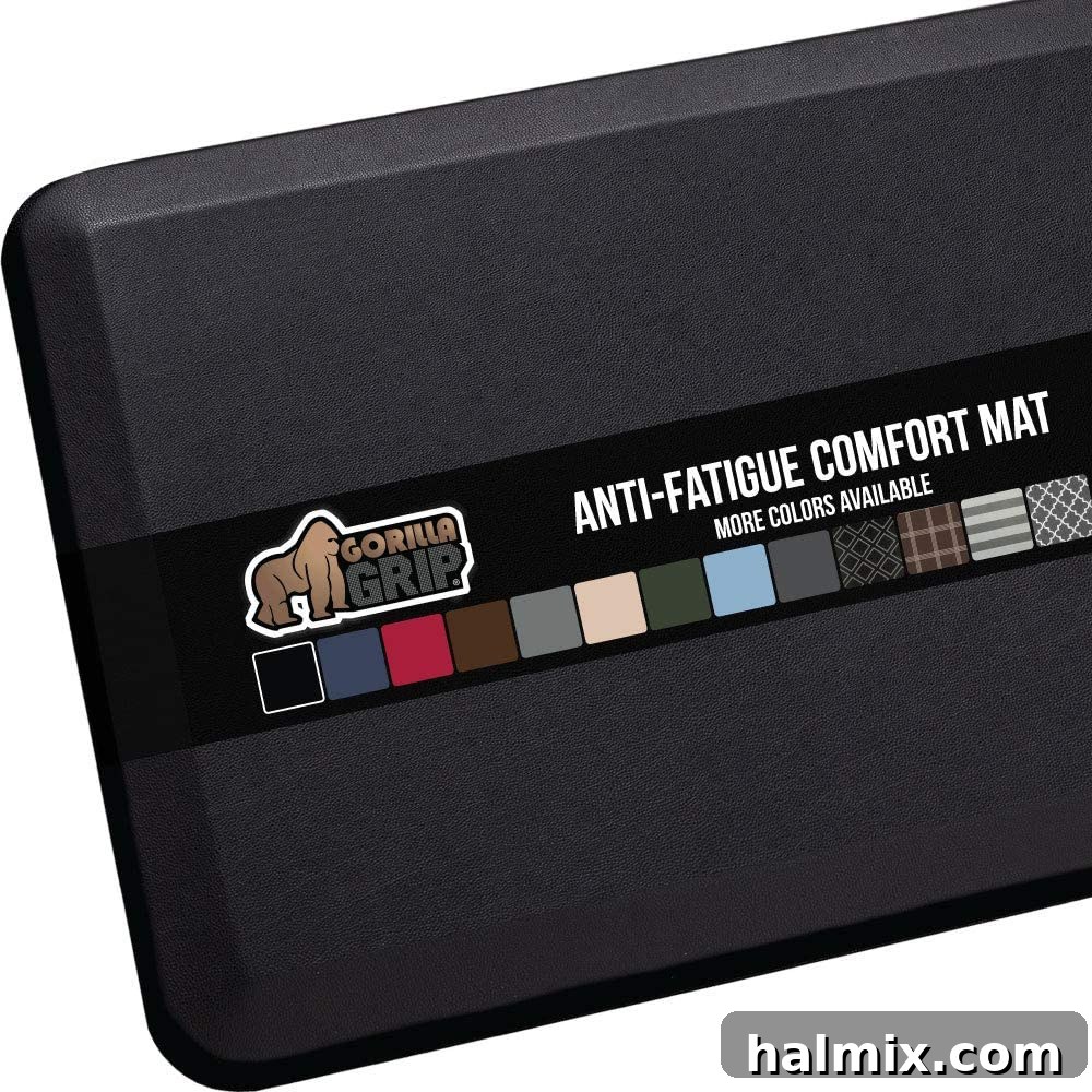 21 Clever Kitchen Gadgets You'll Use Constantly 20 A black anti-fatigue comfort mat placed in a kitchen, indicating ergonomic support for standing.