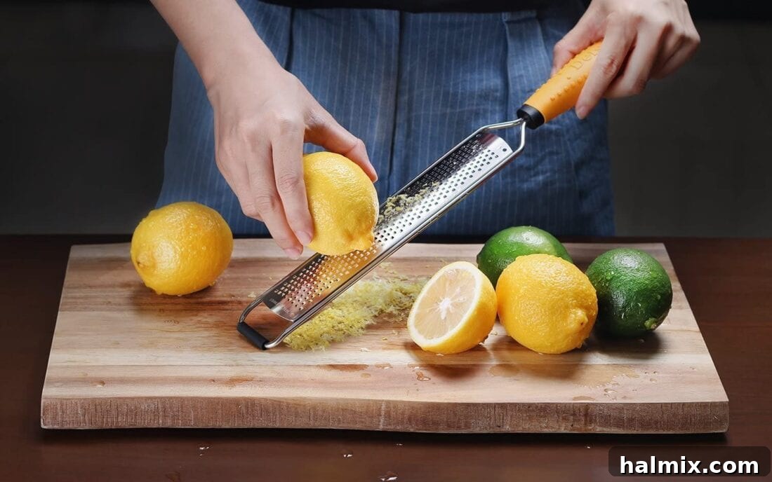 21 Clever Kitchen Gadgets You'll Use Constantly 9 Zesting a fresh lemon with a micro-planer, demonstrating its fine grating capability.