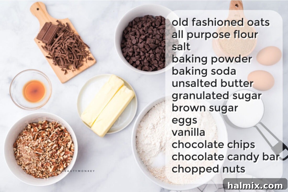 A flat lay photograph showcasing all the dry and wet ingredients laid out for making Neiman Marcus cookies, clearly labeled.