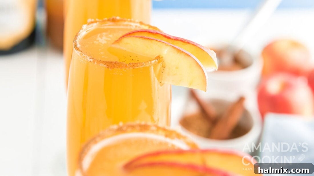 Glasses garnished with apple slices, ready to be served.