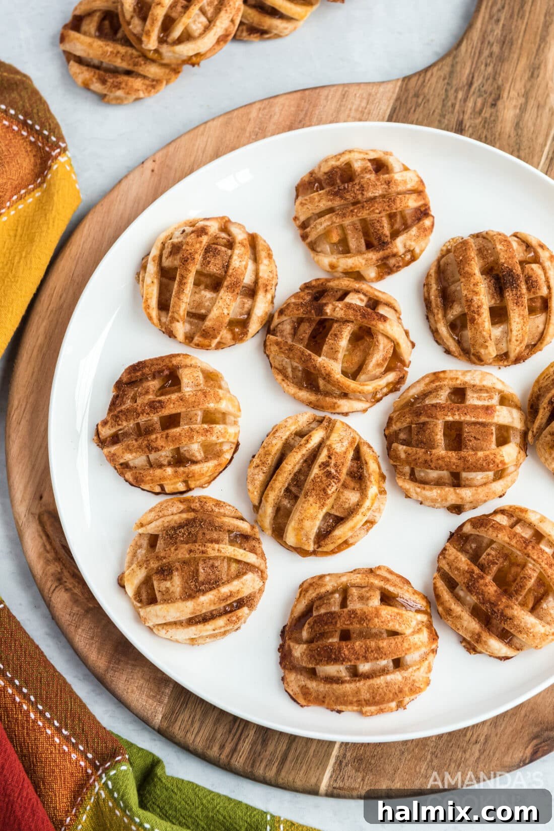 apple pie cookies on a round cutter board