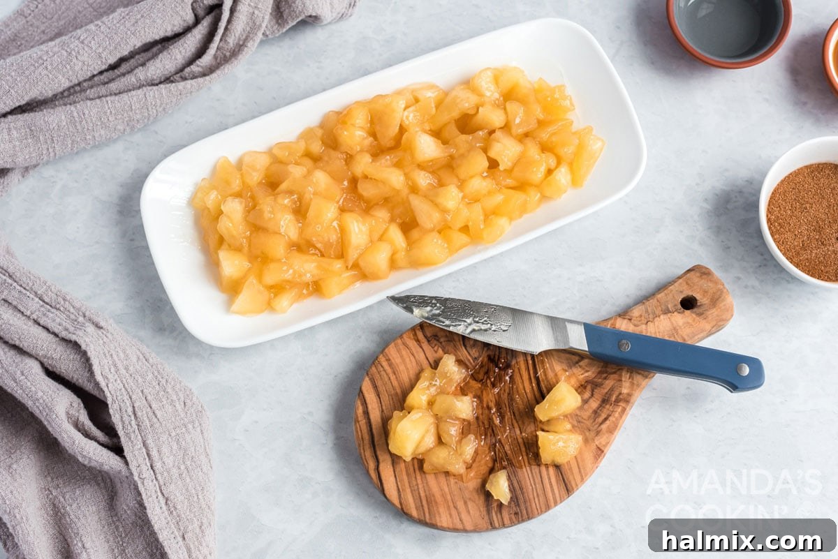 apple pie filing and a cutting board and knife