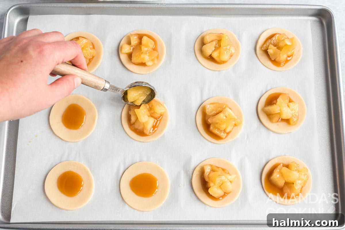 adding apples to caramel