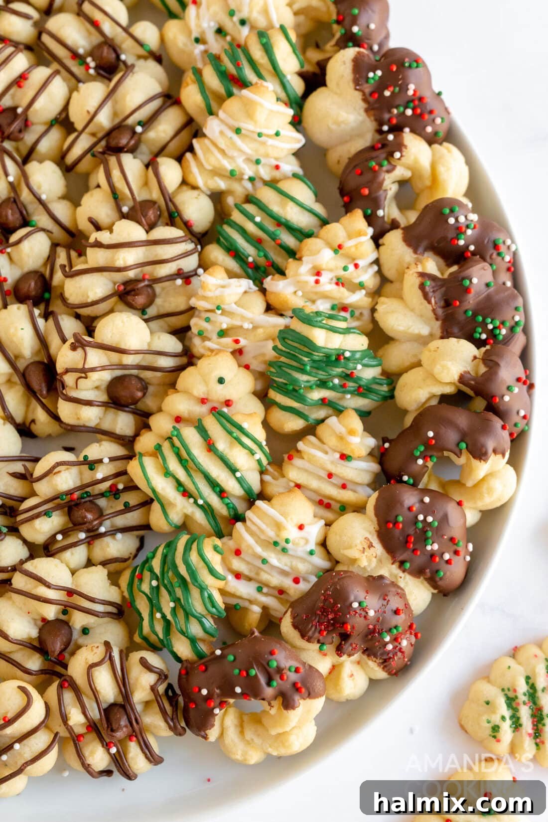 plate of decorated spritz cookies, ready for holiday festivities