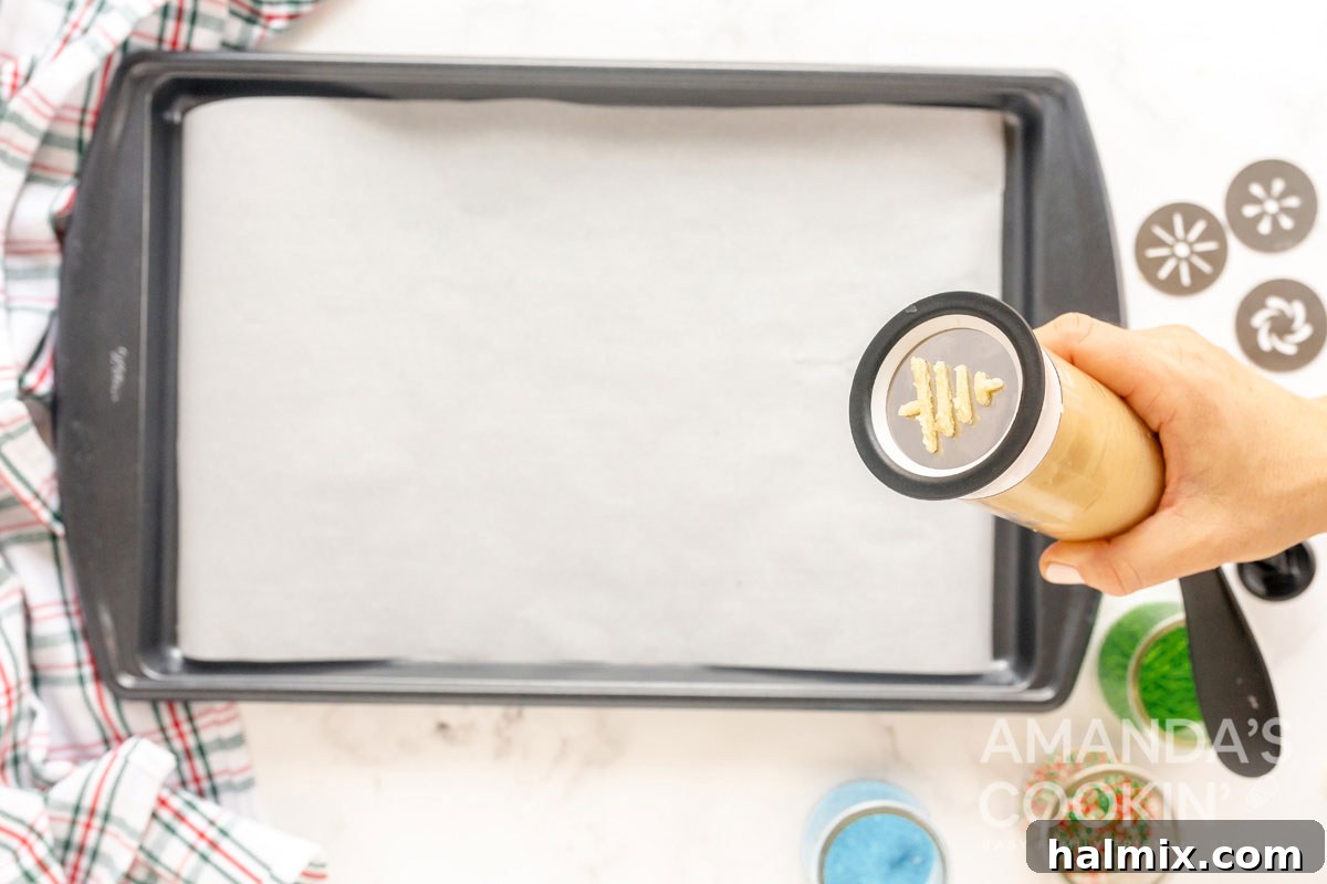close-up view from the bottom of a cookie press as dough is extruded