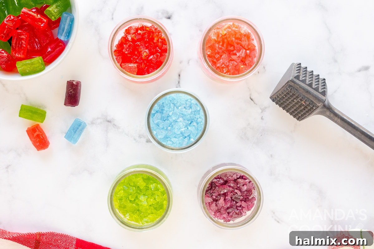 Crushed colorful candies, sorted by color, sitting in small bowls, ready to be used.