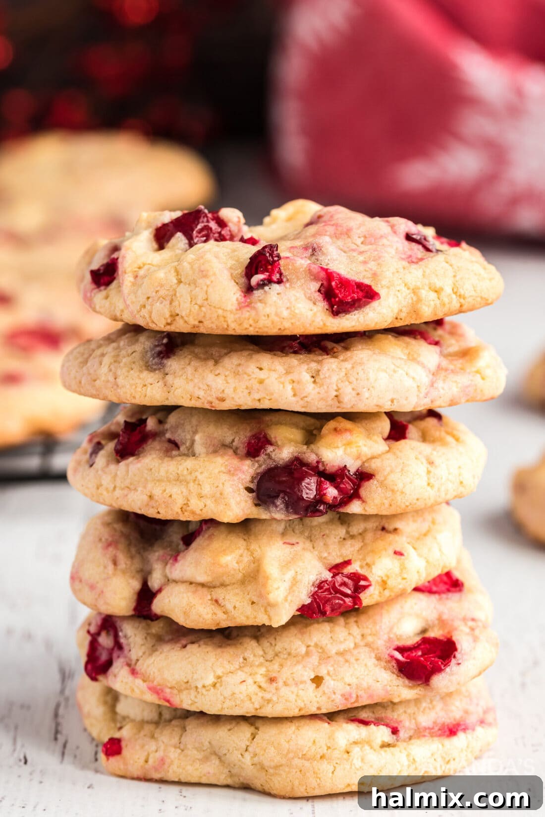 Sweet-Tart White Chocolate Cranberry Delights 2 Stacked White Chocolate Cranberry Cookies on a serving tray, perfect for holiday gatherings.