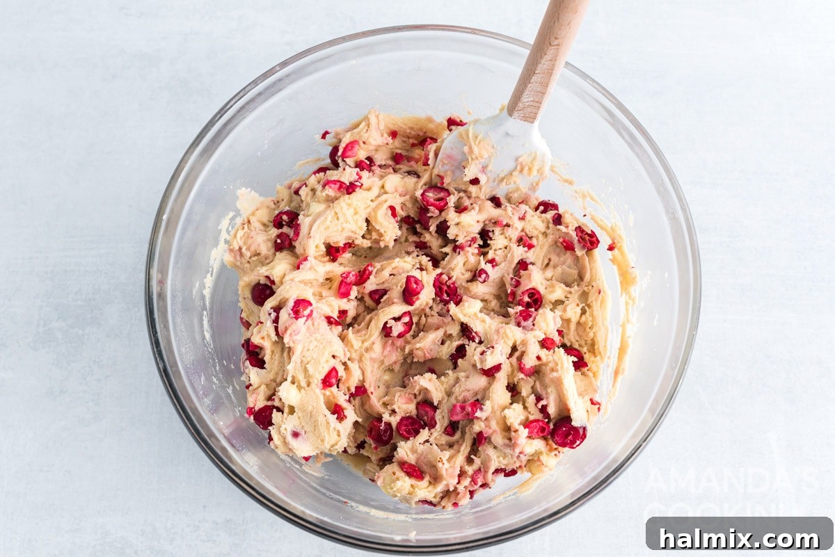 The completed White Chocolate Cranberry Cookie dough in a mixing bowl, ready for baking.