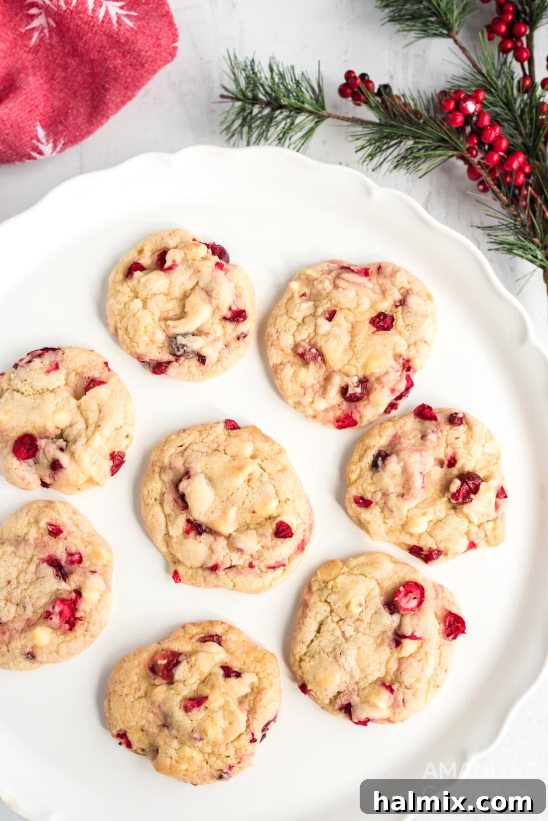 Sweet-Tart White Chocolate Cranberry Delights 3 A plate brimming with freshly baked White Chocolate Cranberry Cookies, ready for enjoyment.