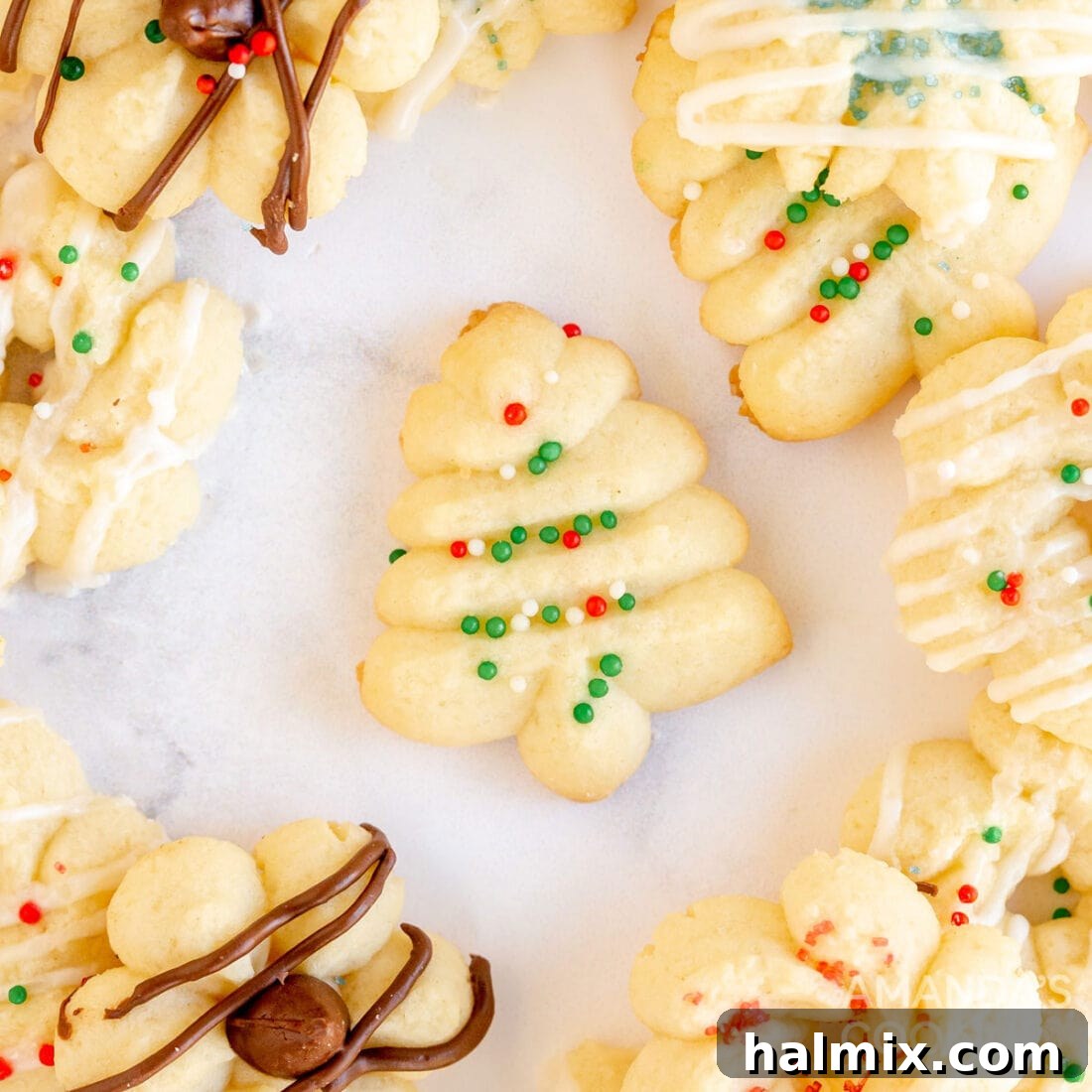 An inviting display of beautifully shaped spritz cookies on a plate, showcasing their intricate designs and light texture, perfect for holiday gatherings.