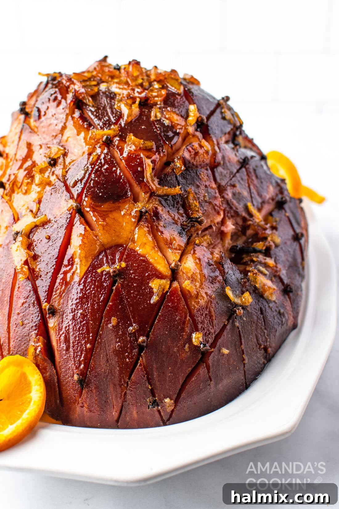 Perfectly glazed ham studded with cloves, ready for a festive dinner