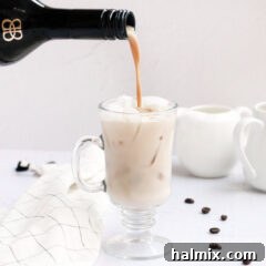 Close-up of a Bailey's White Russian cocktail, garnished with ice