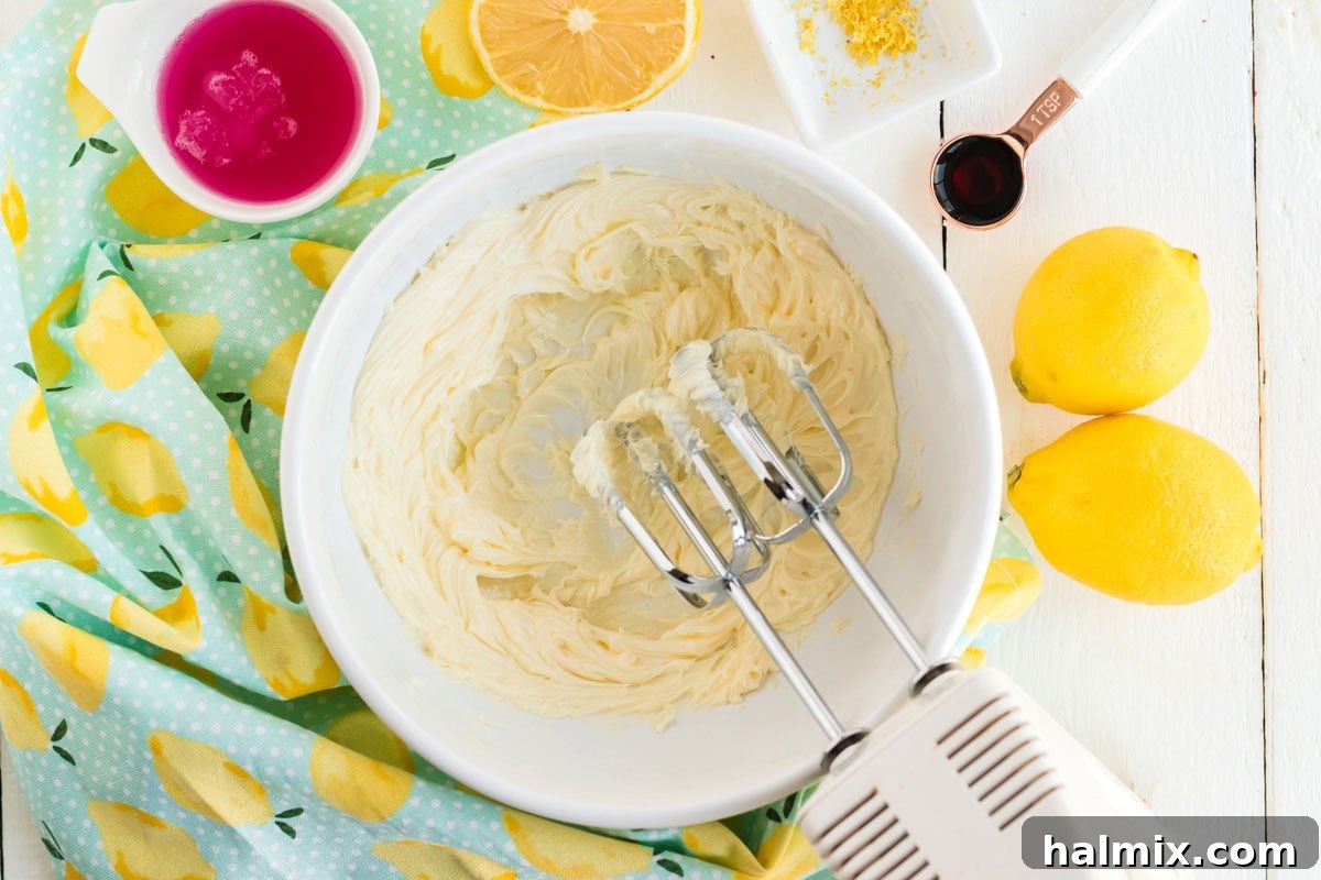 Beating butter in a bowl with a mixer until smooth