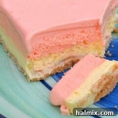 A close up photo of a slice of frozen orange dream squares.