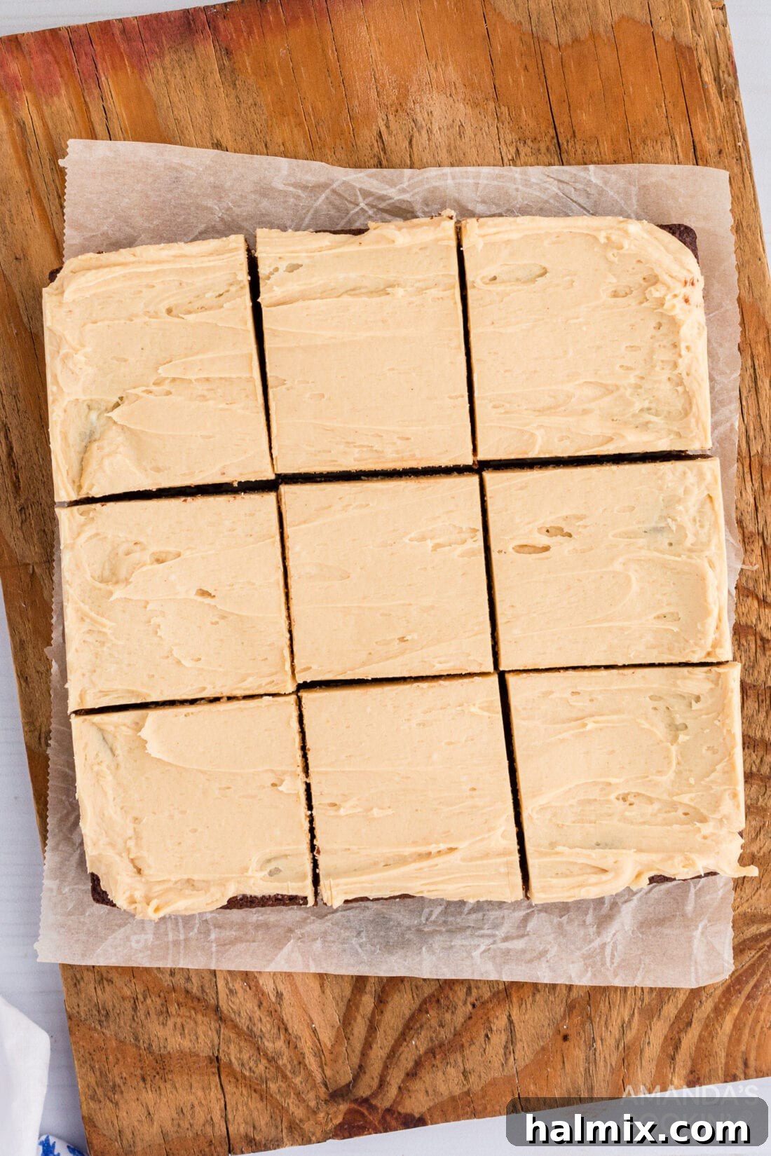 Frosted brownies neatly cut into perfect squares, ready to be served.