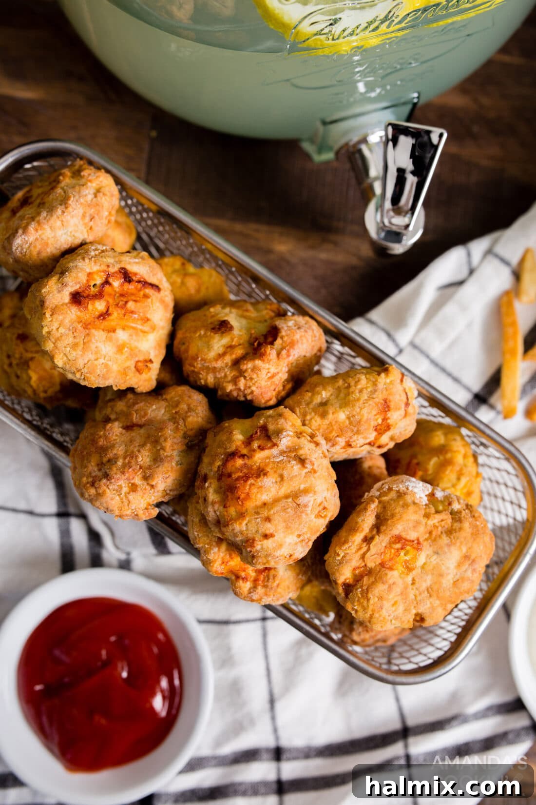 A basket overflowing with perfectly golden brown, crispy air fryer chicken nuggets, ready to be enjoyed.