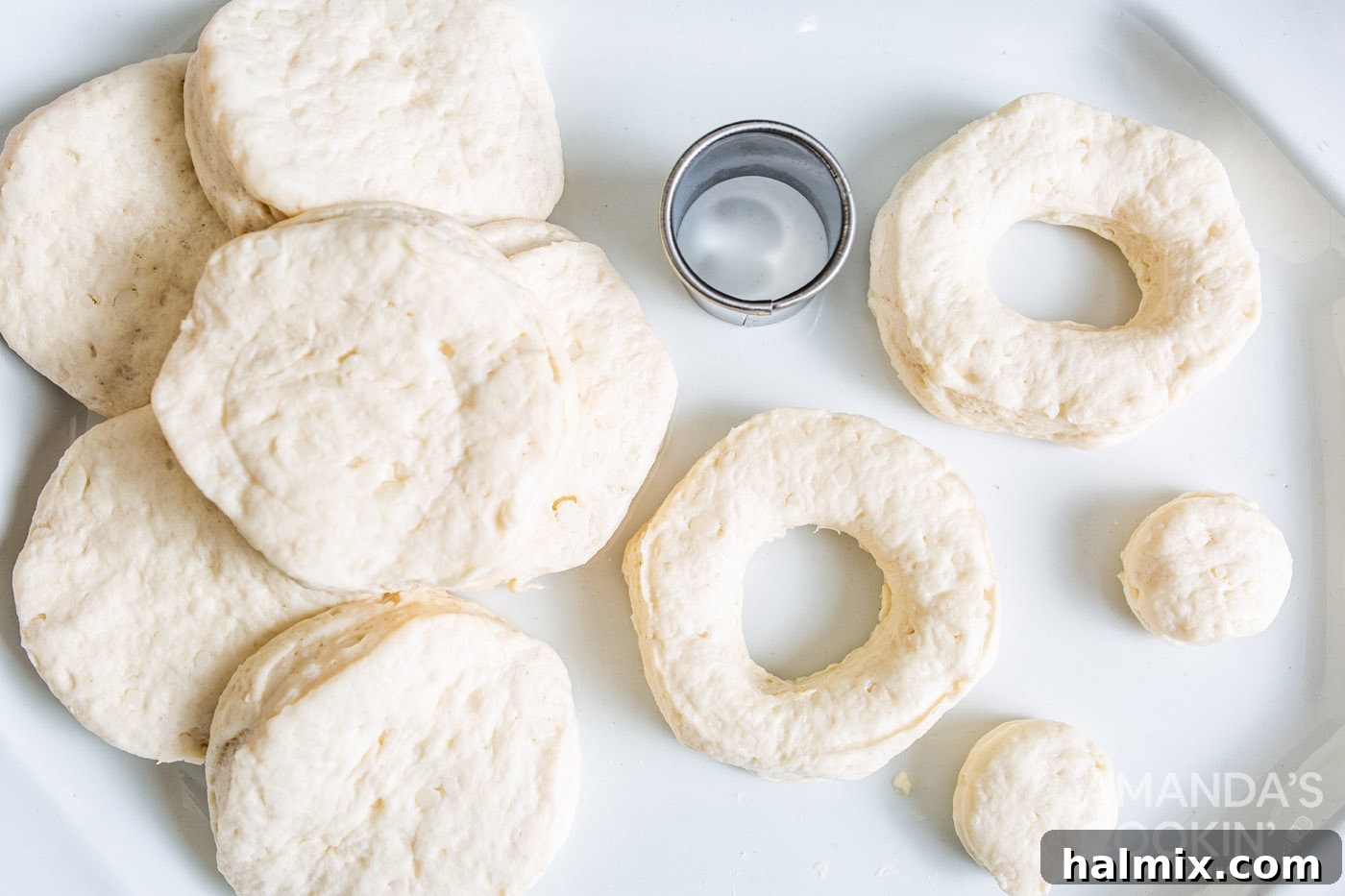 canned biscuits cut into donut shapes with centers removed