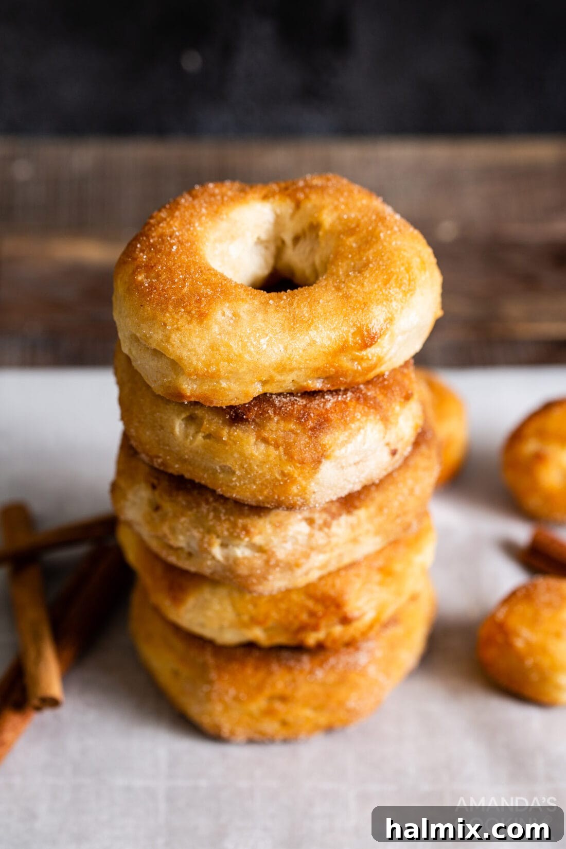 stack of cinnamon sugar air fryer donuts on a plate